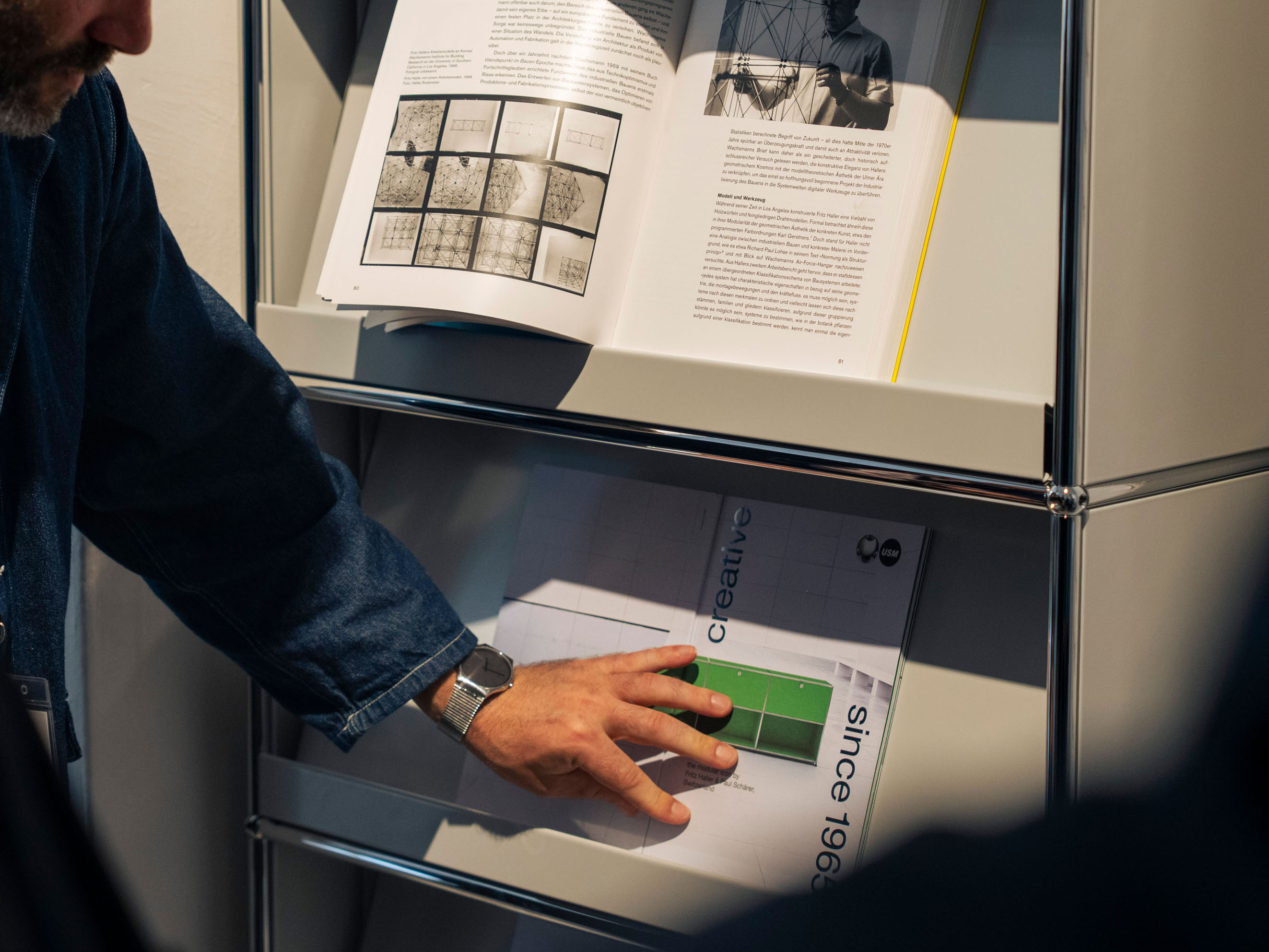 Person browsing design brand catalogs
